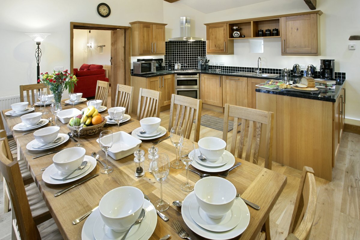 Well equipped kitchen with oak dining table for 12